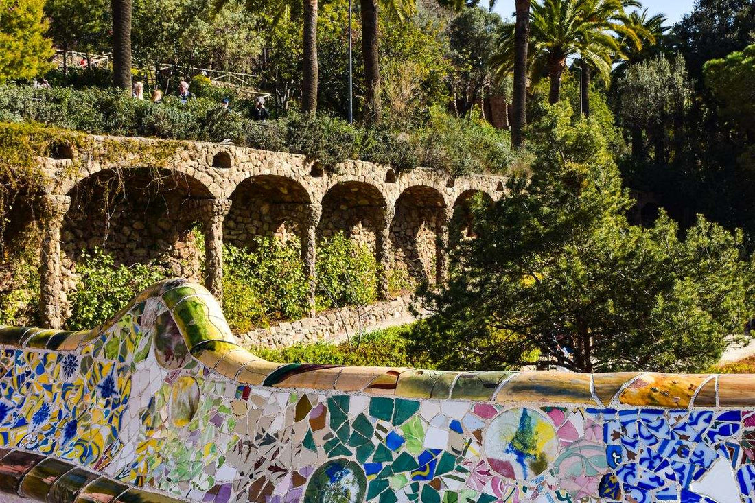 Mosaic bench and towers of Park Güell in Barcelona, designed by Gaudí